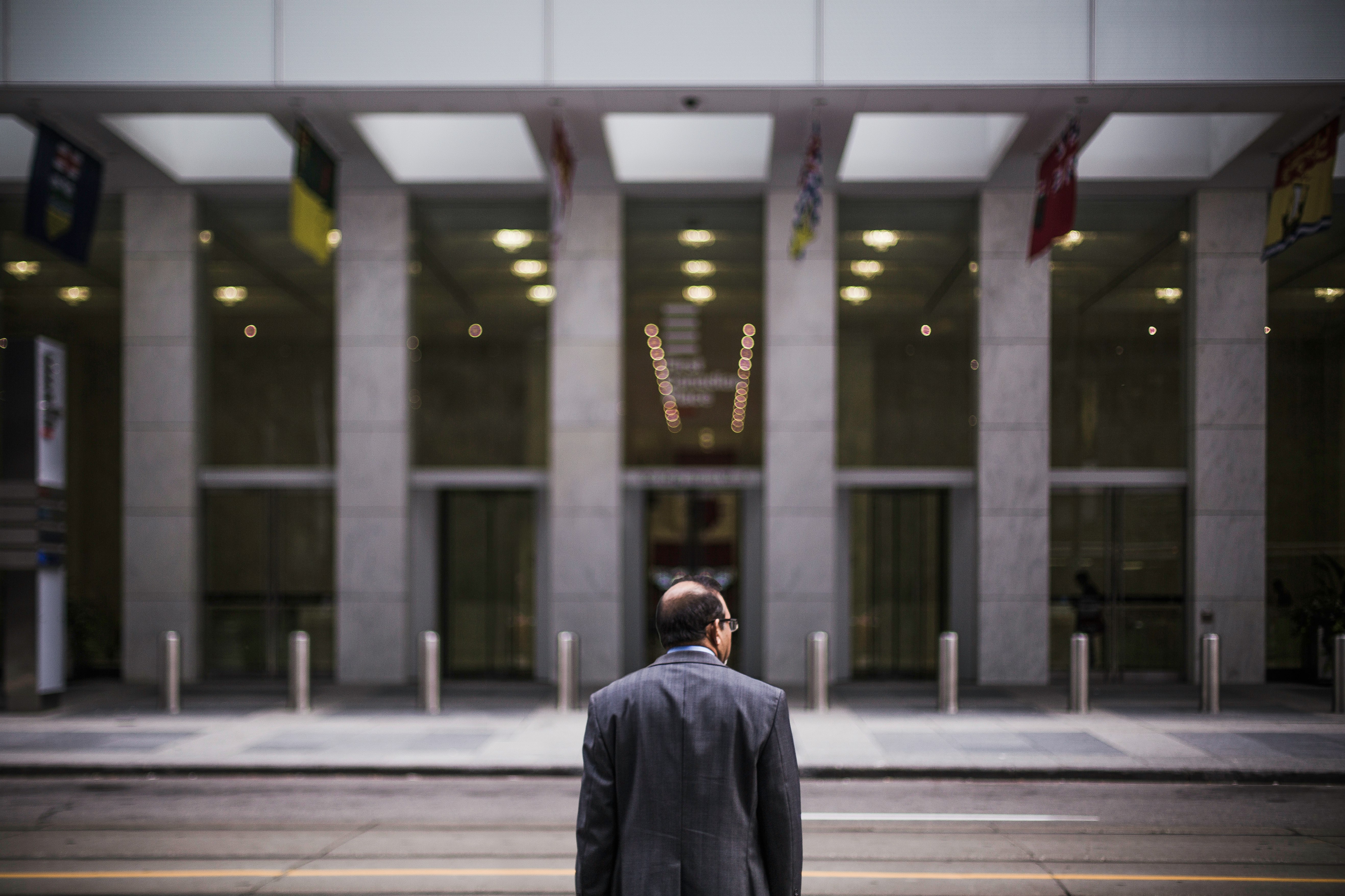 man standing in front of building